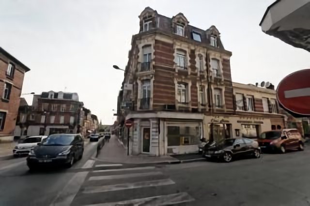 Saint Quentin - Rue Emile Zola - View East on Hotel Le Florence