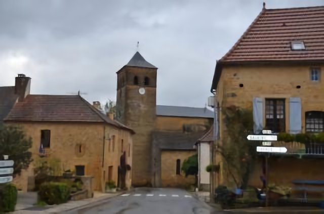 the ancient village Marminiac at Lot district with a nice church just beside of the road