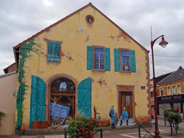 Fresque réalisée par l'artiste-peintre Éric Haven à L'Hôpital (Moselle) place du Marché.