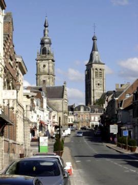 The city of Le Cateau-Cambrésis, with belfry (left) and church tower (right).