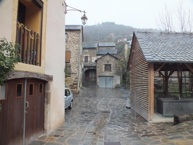 Le Truel, Aveyron, France in December, and raining! The Lavoir in the rejuvenated village centre paved in slate.